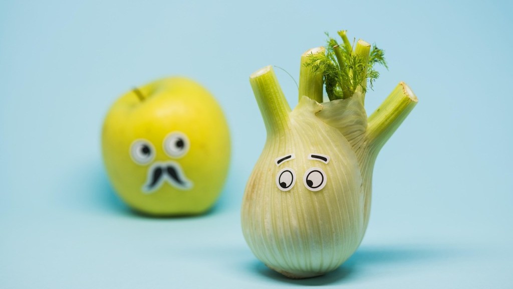 A quirky fennel with cartoon eyes and a sprig of greenery, next to a green apple featuring a funny face with large googly eyes and a moustache, set against a light blue background.