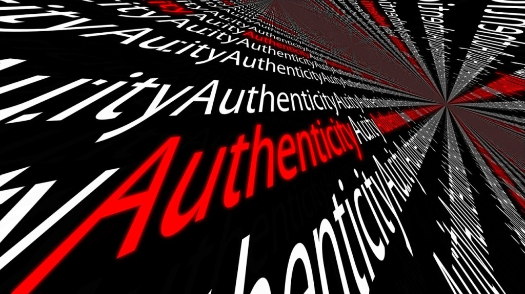 A digital graphic featuring the word 'Authenticity' in a variety of styles and sizes, with a perspective effect creating a sense of depth. The foreground text is bold and red, while the background text is in white, set against a black background.